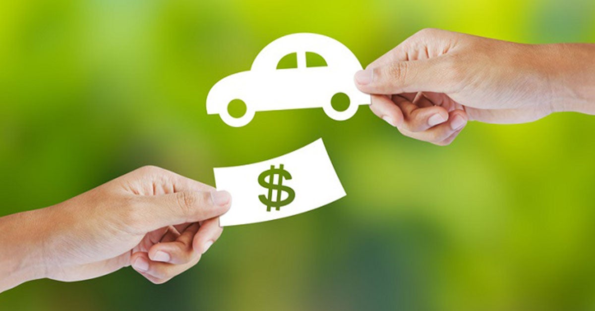 Cash and keys exchanging hands as part of INFINITI trade-in